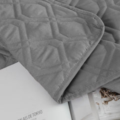Ameritex waterproof blanket placed over a dog bed.