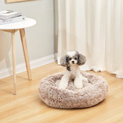 Bedfolks Calming Fluffy Donut Dog Bed with its fluffy faux-fur surface in close-up.