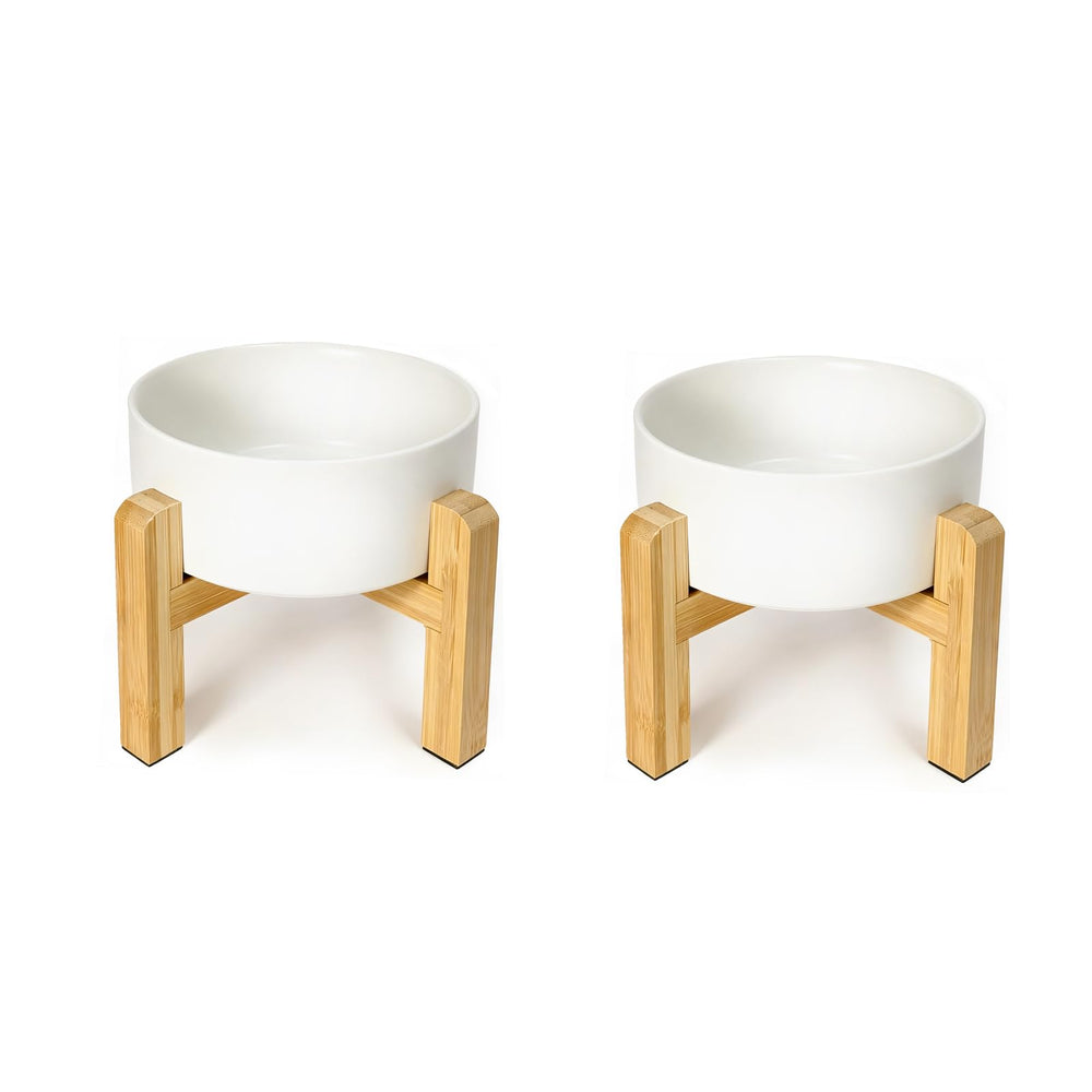 HCHLQLZ raised dog bowl set shown from the front with white ceramic bowls and a bamboo stand.