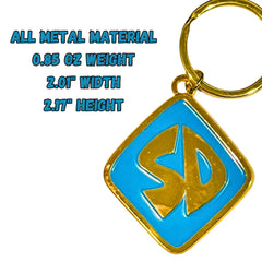 ImagineeringDepot metal dog collar tag with a shiny gold finish and blue accents.
