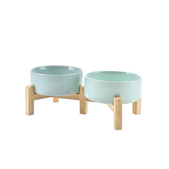 SPUNKYJUNKY elevated dog bowls shown from the front with a ceramic bowl and bamboo stand.
