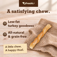 A Freschi srl turkey tendon dog treat displayed in its coil shape.