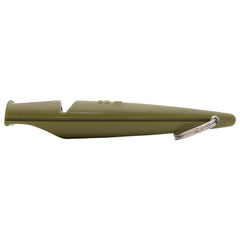 ACME dog training whistle shown in an outdoor training setting.