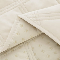 Ameritex dog bed cover laid across a sofa for pet furniture protection.