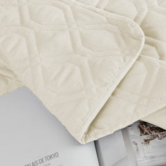 Ameritex dog blanket cover placed across a sofa.