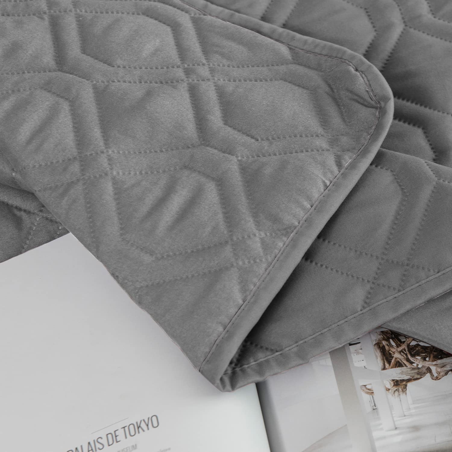 Ameritex waterproof blanket placed over a dog bed.