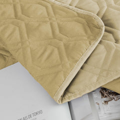 Ameritex waterproof dog bed blanket covering a sofa.