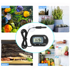 AQUANEAT aquarium thermometer positioned for use in a terrarium.