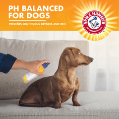 ARM & HAMMER Waterless Dog Shampoo Spray being applied to a dog's coat.