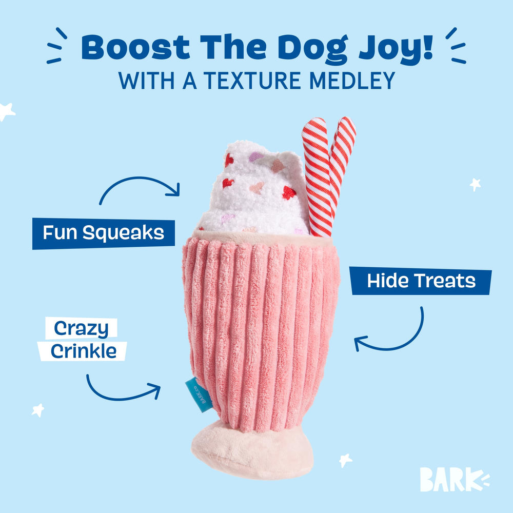 BarkBox Red Whine Milkshake plush dog toy with its soft fuzz in close-up.