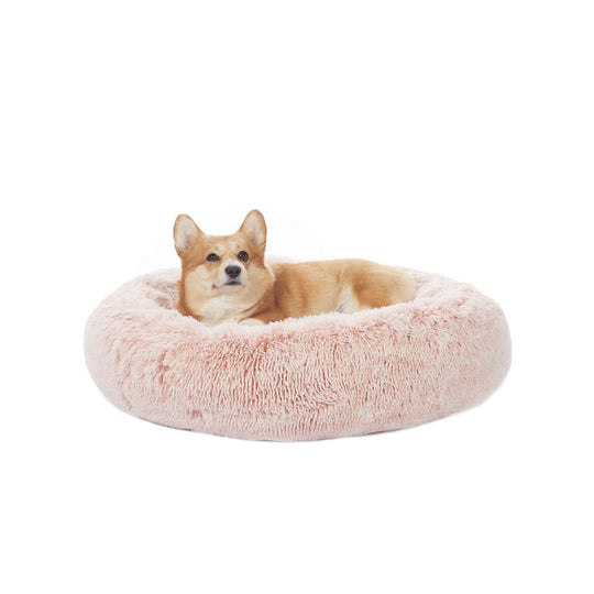 Bedfolks donut dog bed shown from the front in pink.