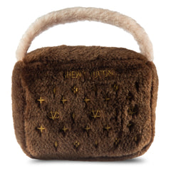 Dog Diggin Designs Chewy Vuiton plush dog toy shown from the front in its purse shape.