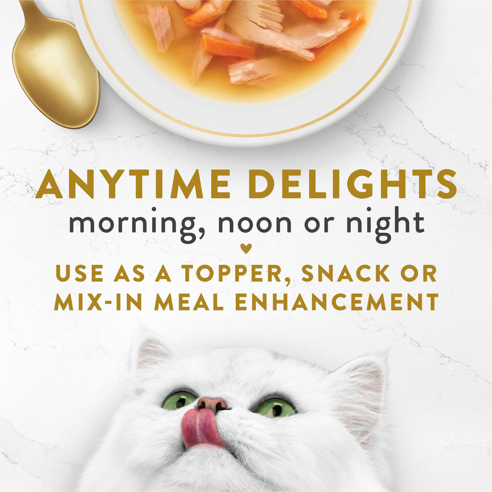 Fancy Feast Broths Classic cat food topper shown added to a cat’s meal.