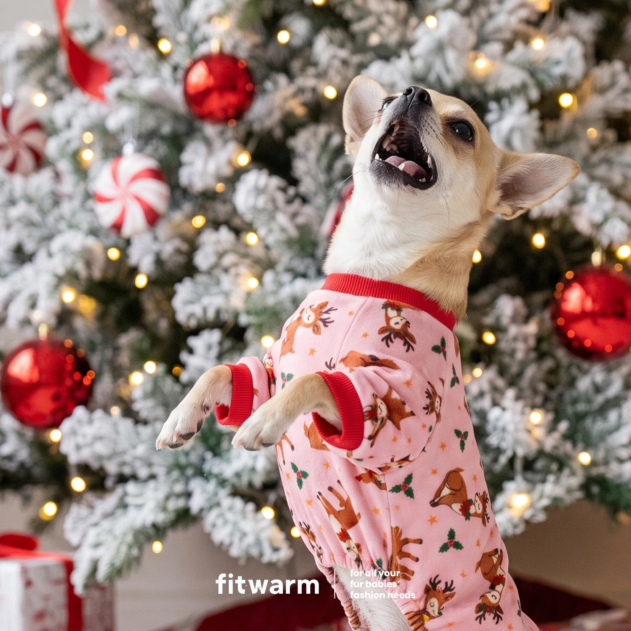 Fitwarm Christmas reindeer dog pajamas detail showing holly and star accents on pink fabric.
