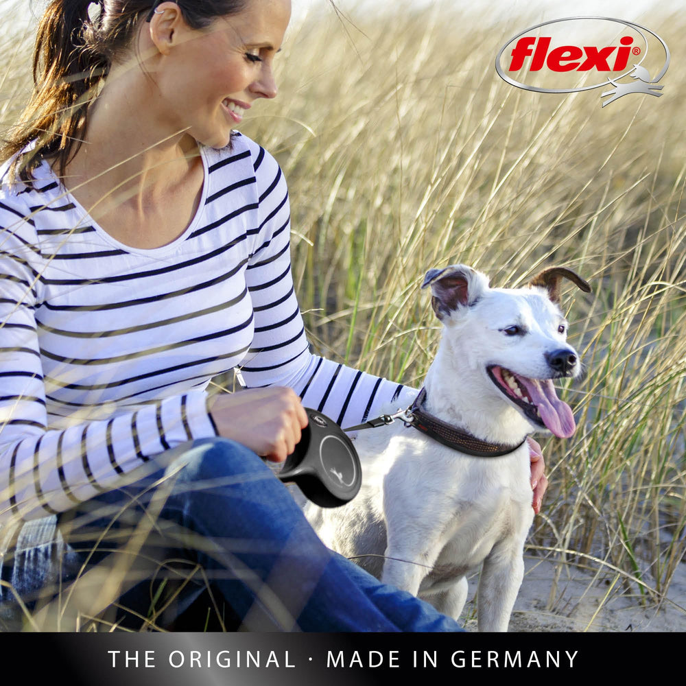 FLEXI Classic Double Cord retractable dog leash being used to walk two dogs.