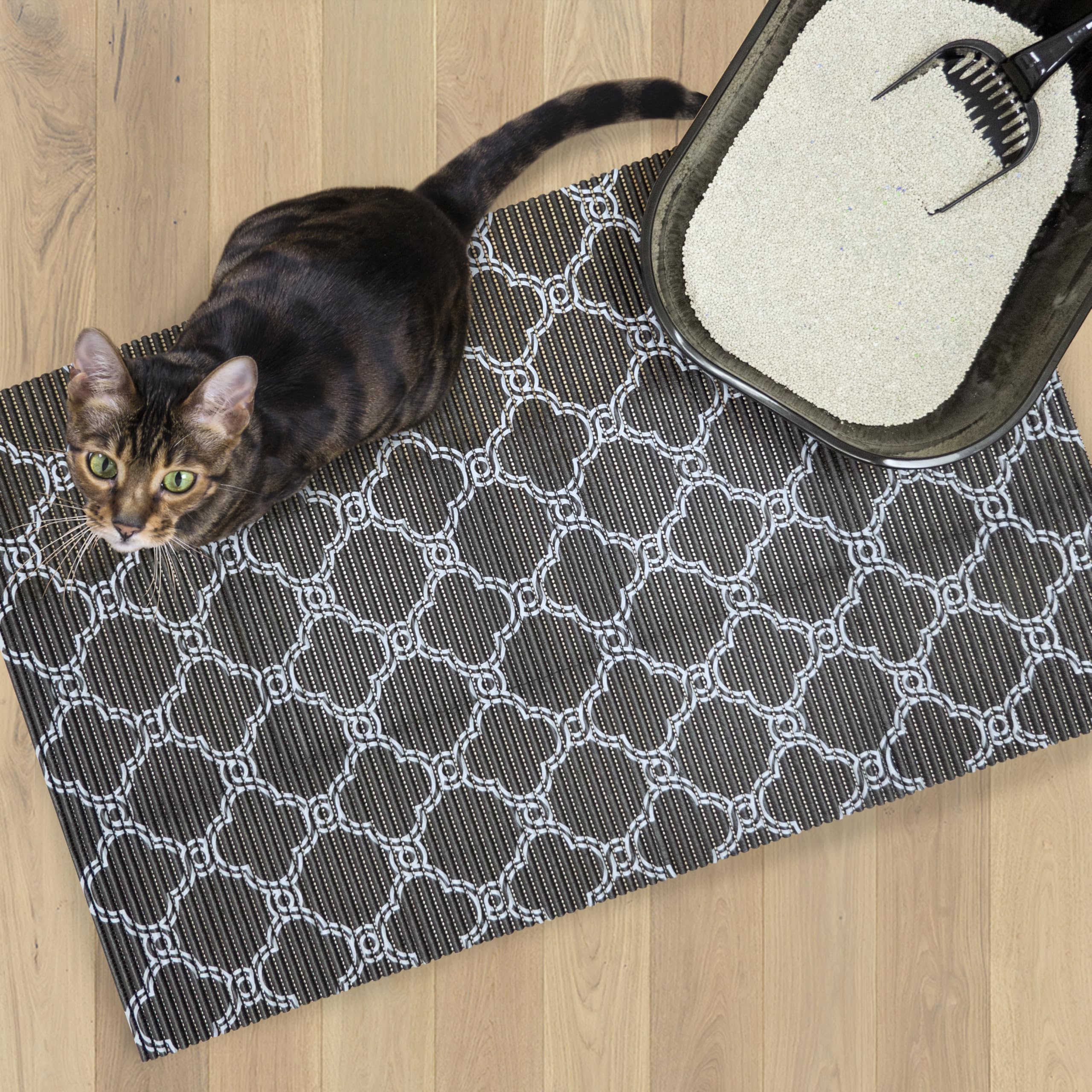 Fresh Kitty foam litter mat showing the black and white quatrefoil design.
