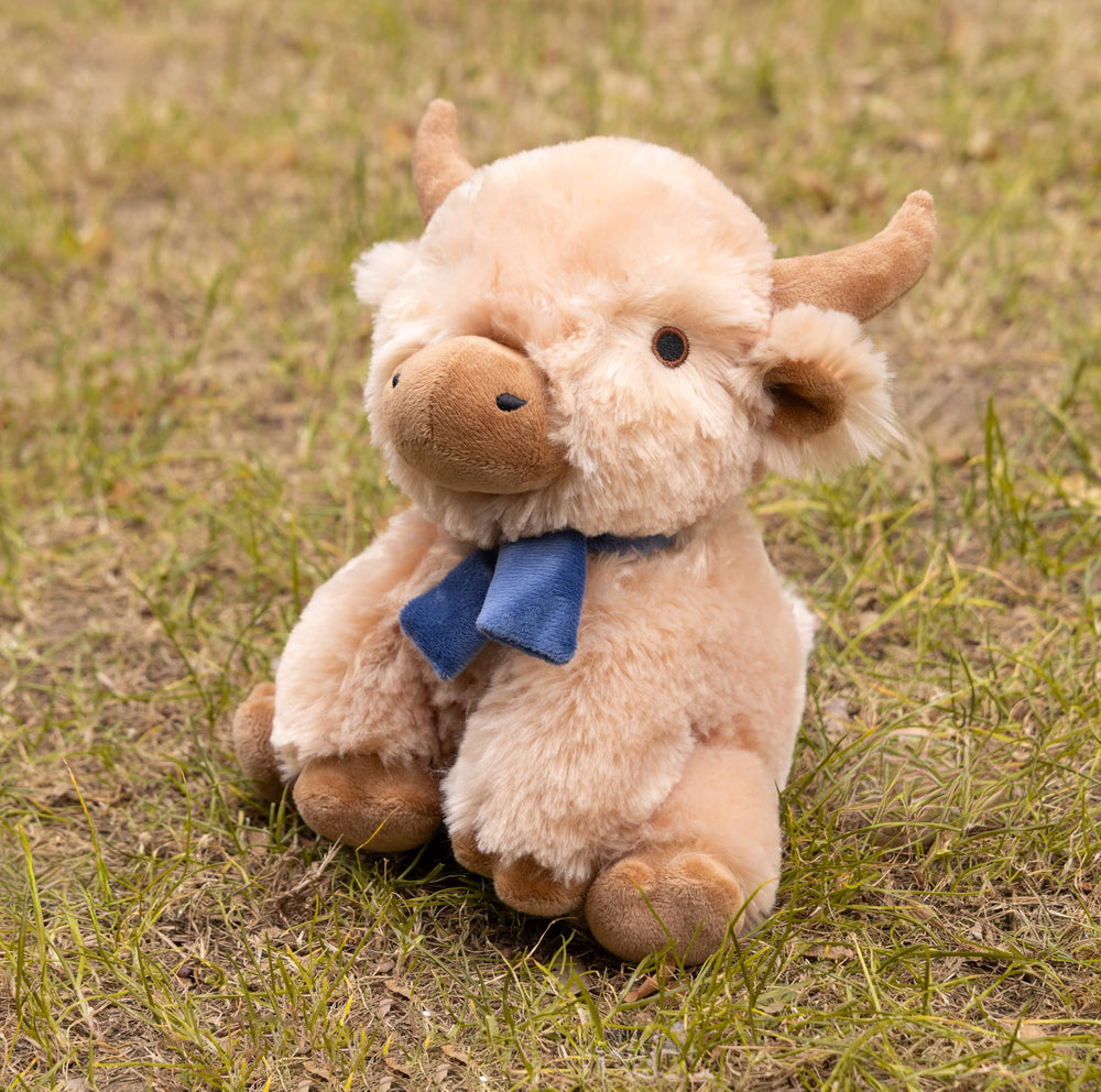 Fuzzl Highland Cow plush dog toy with the built-in moo squeaker feature.
