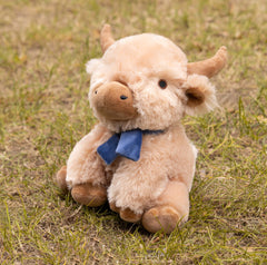 Fuzzl Highland Cow plush dog toy with the built-in moo squeaker feature.