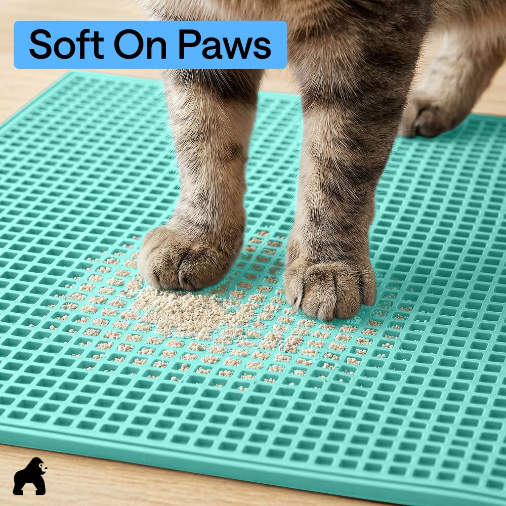 GORILLA GRIP Cat Litter Mat being wiped clean.