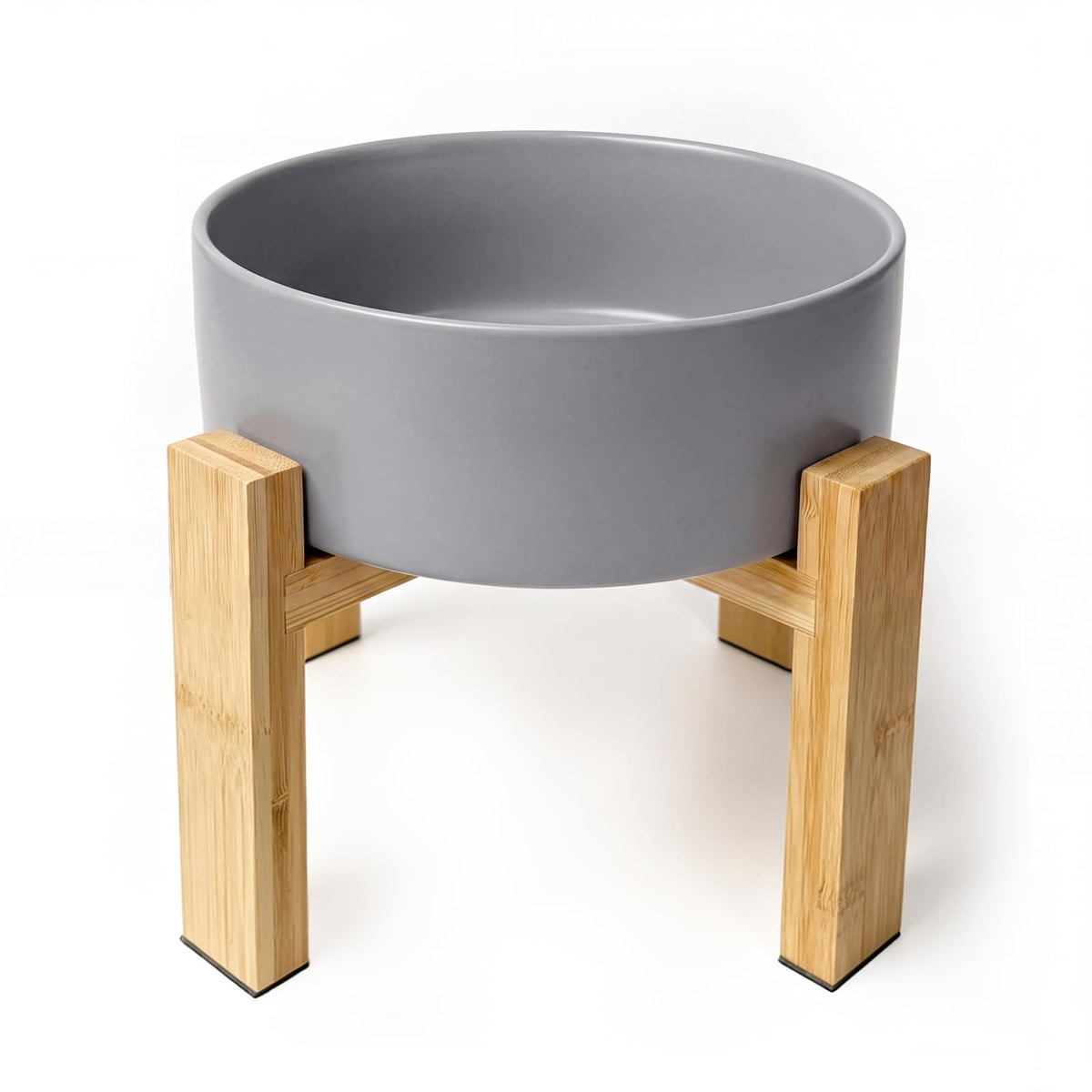 HCHLQLZ elevated ceramic dog bowl shown from the front with its bamboo stand.