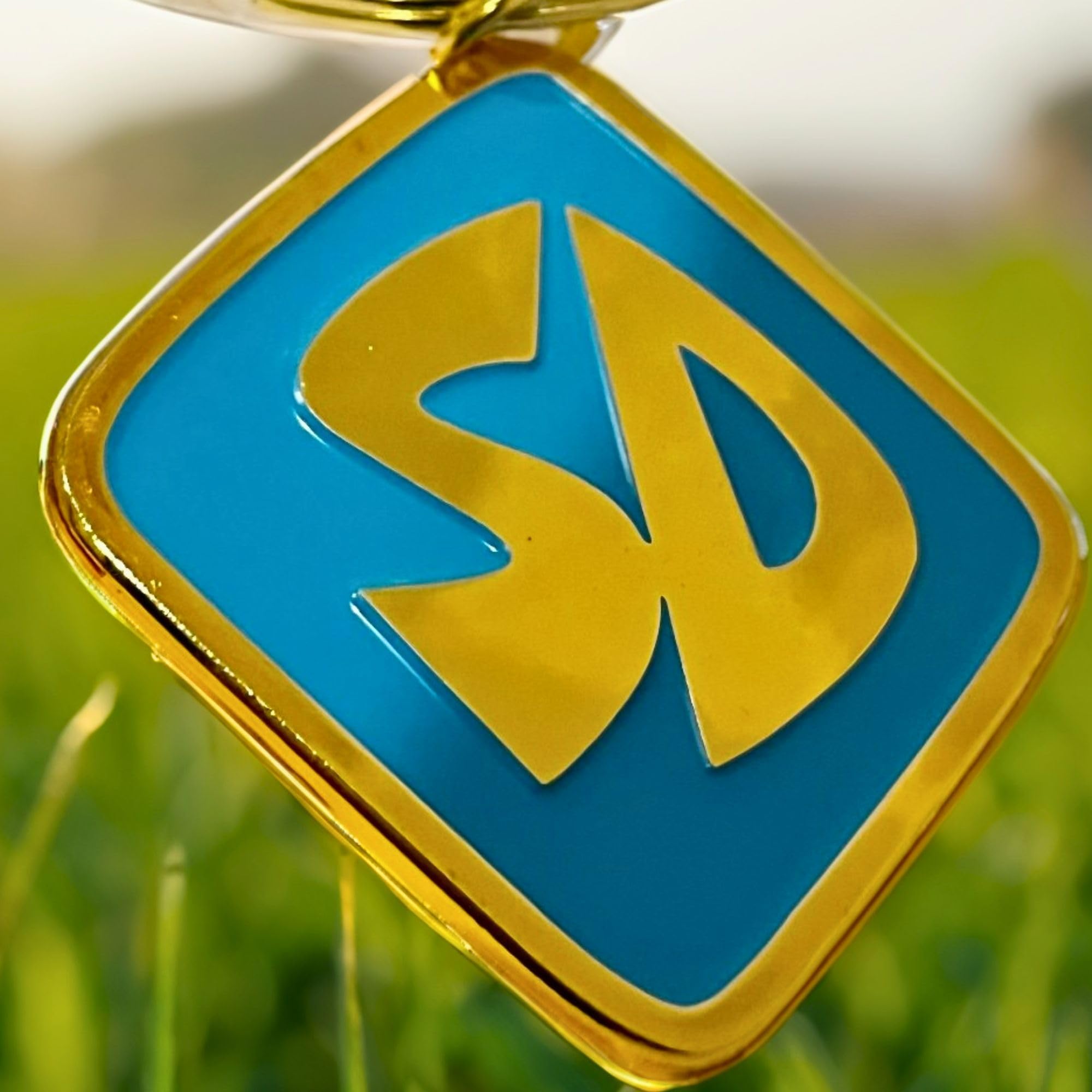 ImagineeringDepot metal dog collar tag shown from the side to show its profile.