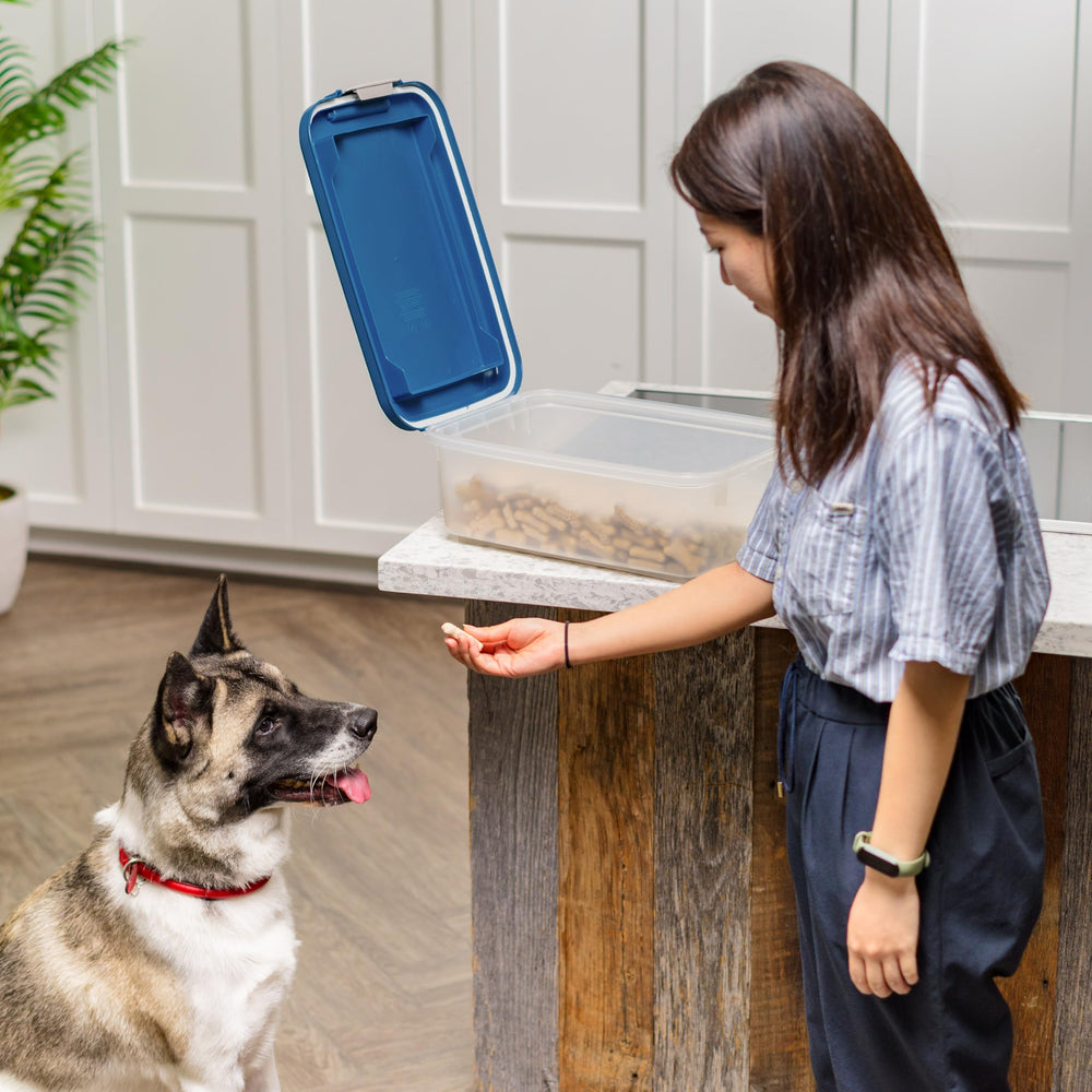 IRIS USA Dog Food Storage Container shown open to reveal its storage interior.