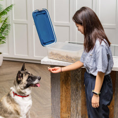 IRIS USA Dog Food Storage Container shown open to reveal its storage interior.