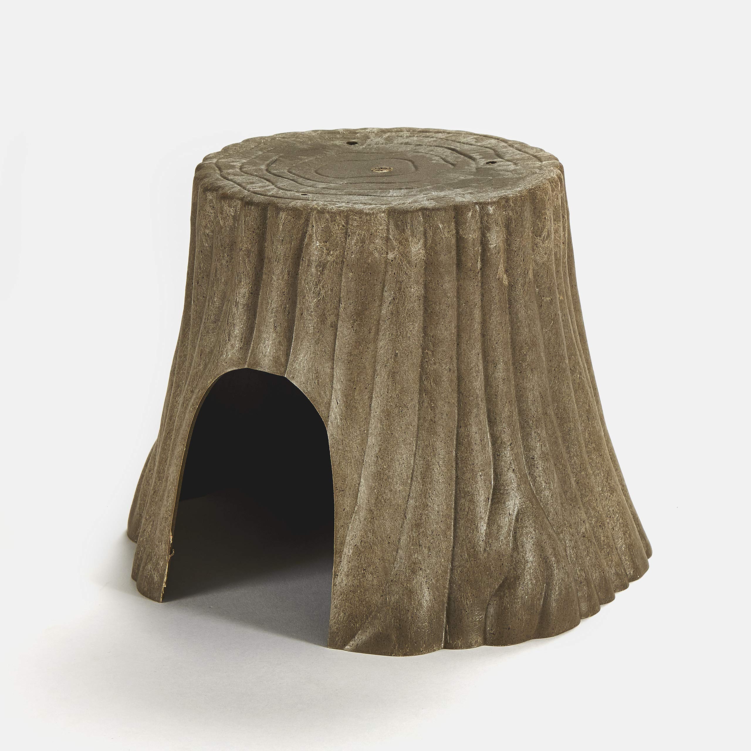 Kaytee Natural Tree Trunk Hideout shown in use as a small animal hiding spot.