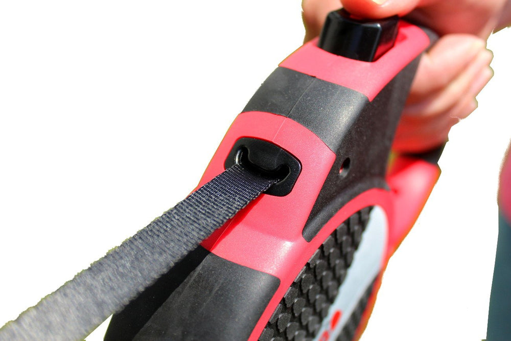 KONG Terrain retractable dog leash shown with its belt extended.