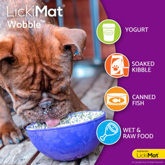 The LICKIMAT Wobble dog lick mat shown tilted to highlight its rocking action.