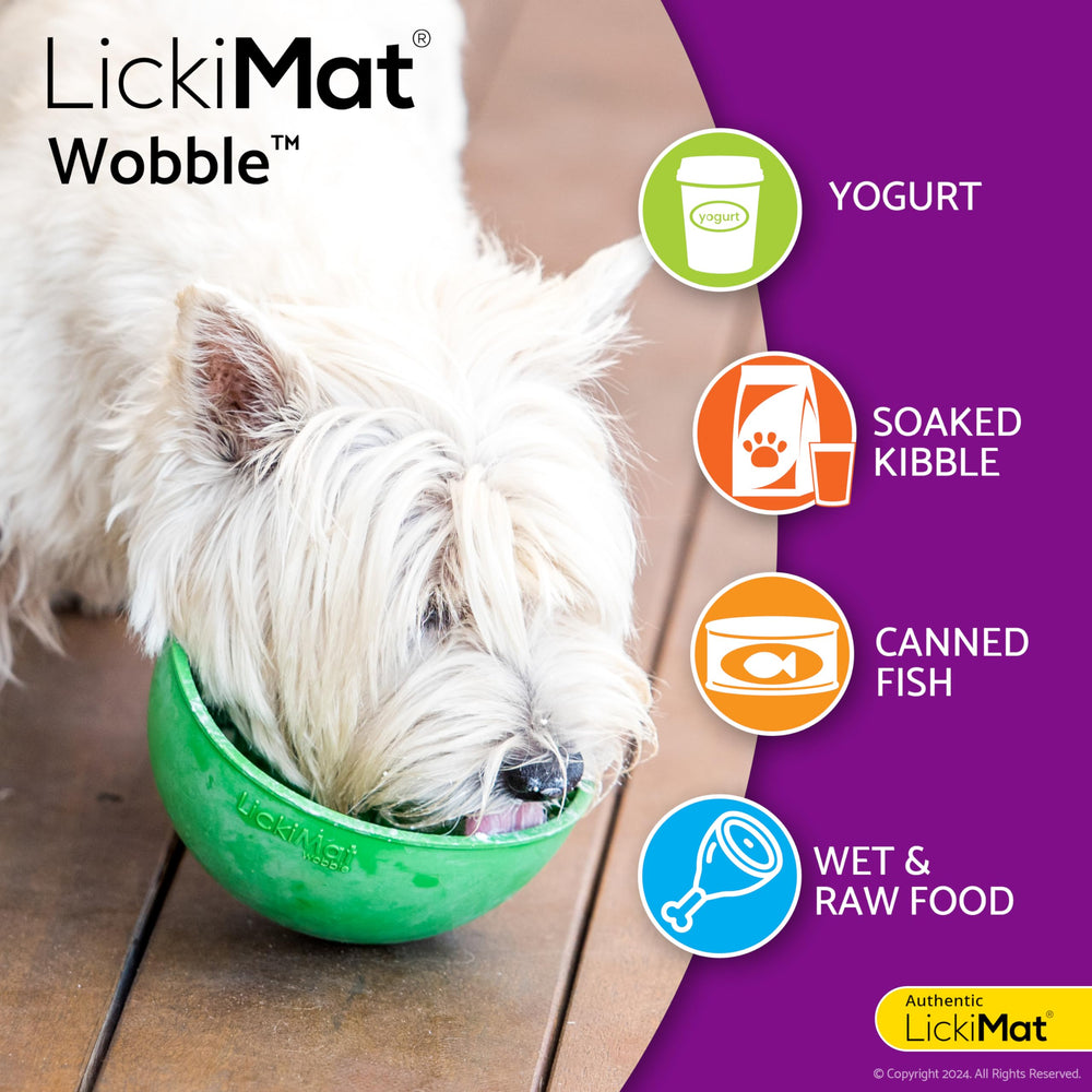A dog licking food from the LICKIMAT Wobble bowl.