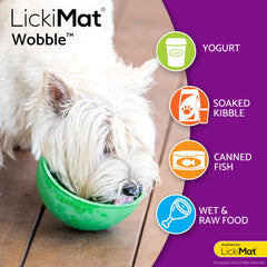 A dog licking food from the LICKIMAT Wobble bowl.