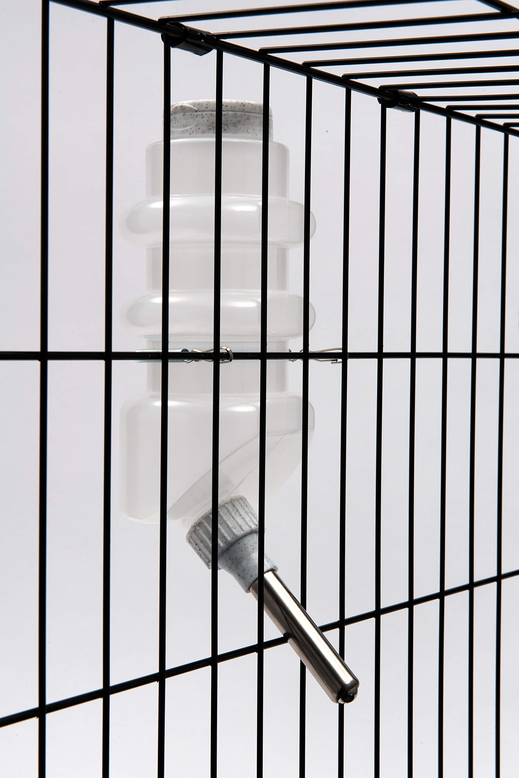Lixit dog water bottle set up for use in a travel cage.
