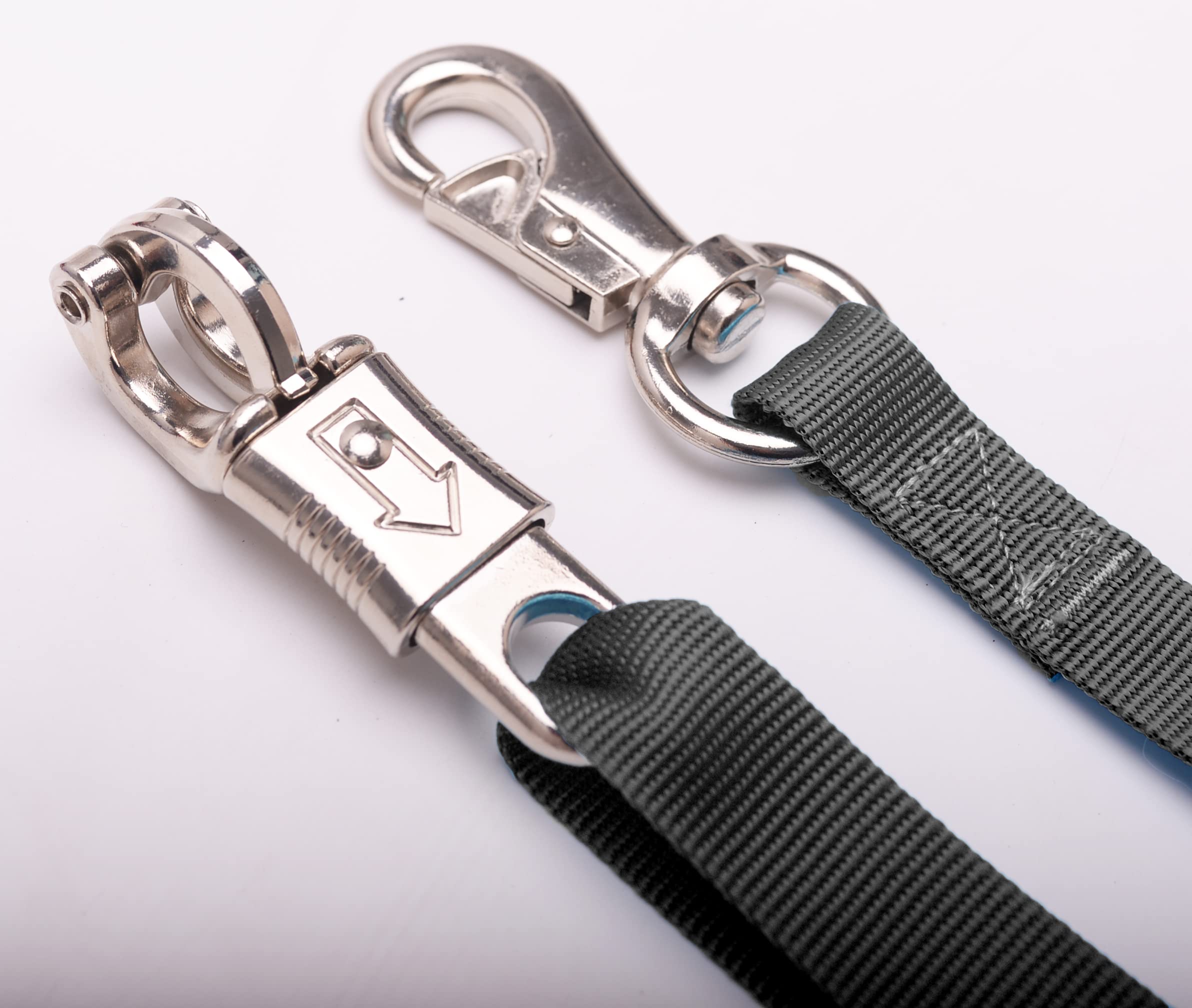 Loaged adjustable nylon cross ties shown in a horse cross-tie setup.