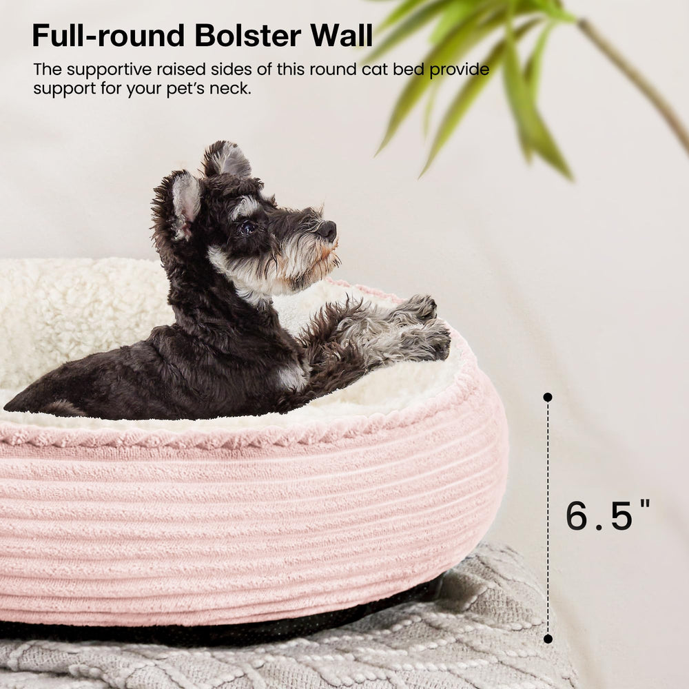 Love's cabin donut pet bed shown as a resting spot for a cat.