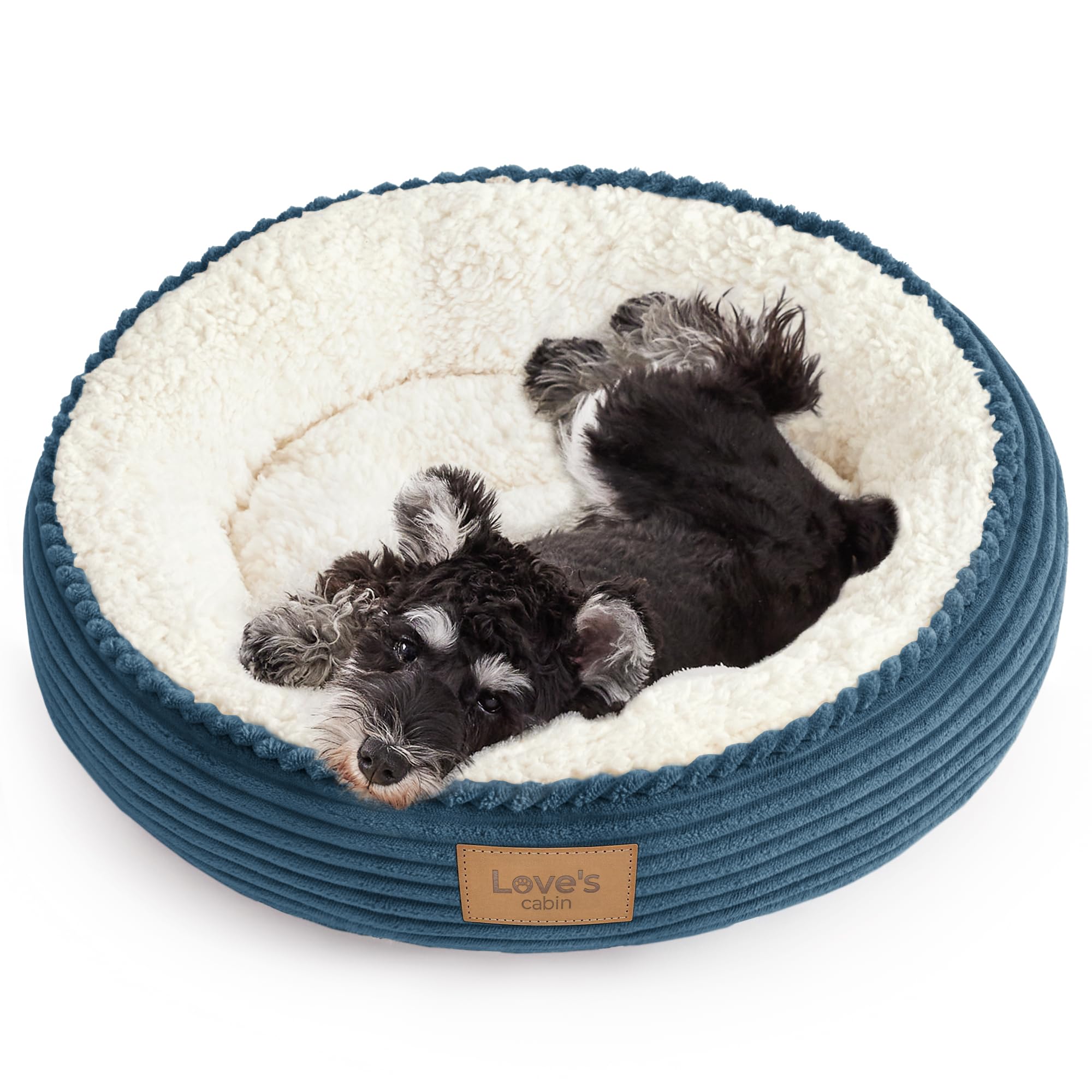Love's cabin round pet bed shown from the front in dusty blue.