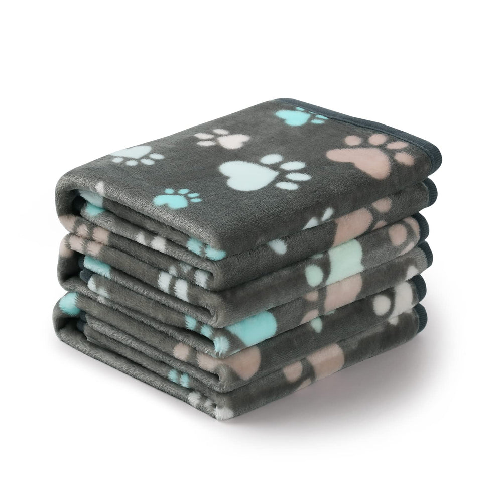 Luciphia pet blanket shown from the front with its grey paw-print design.