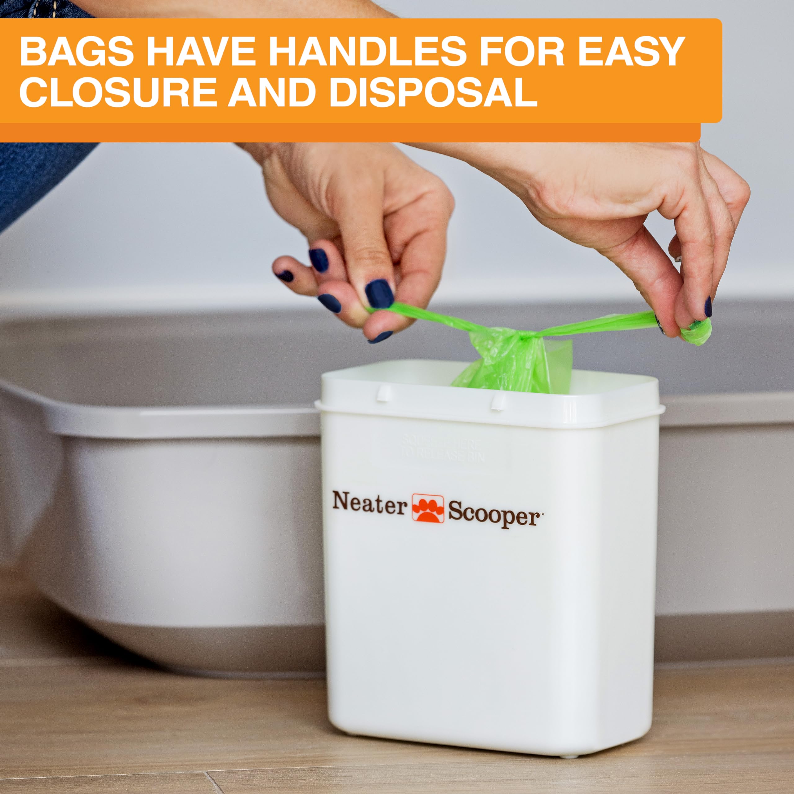 Neater Pet Brands Neater Scooper Standard bag dispenser shown beside the scooper.
