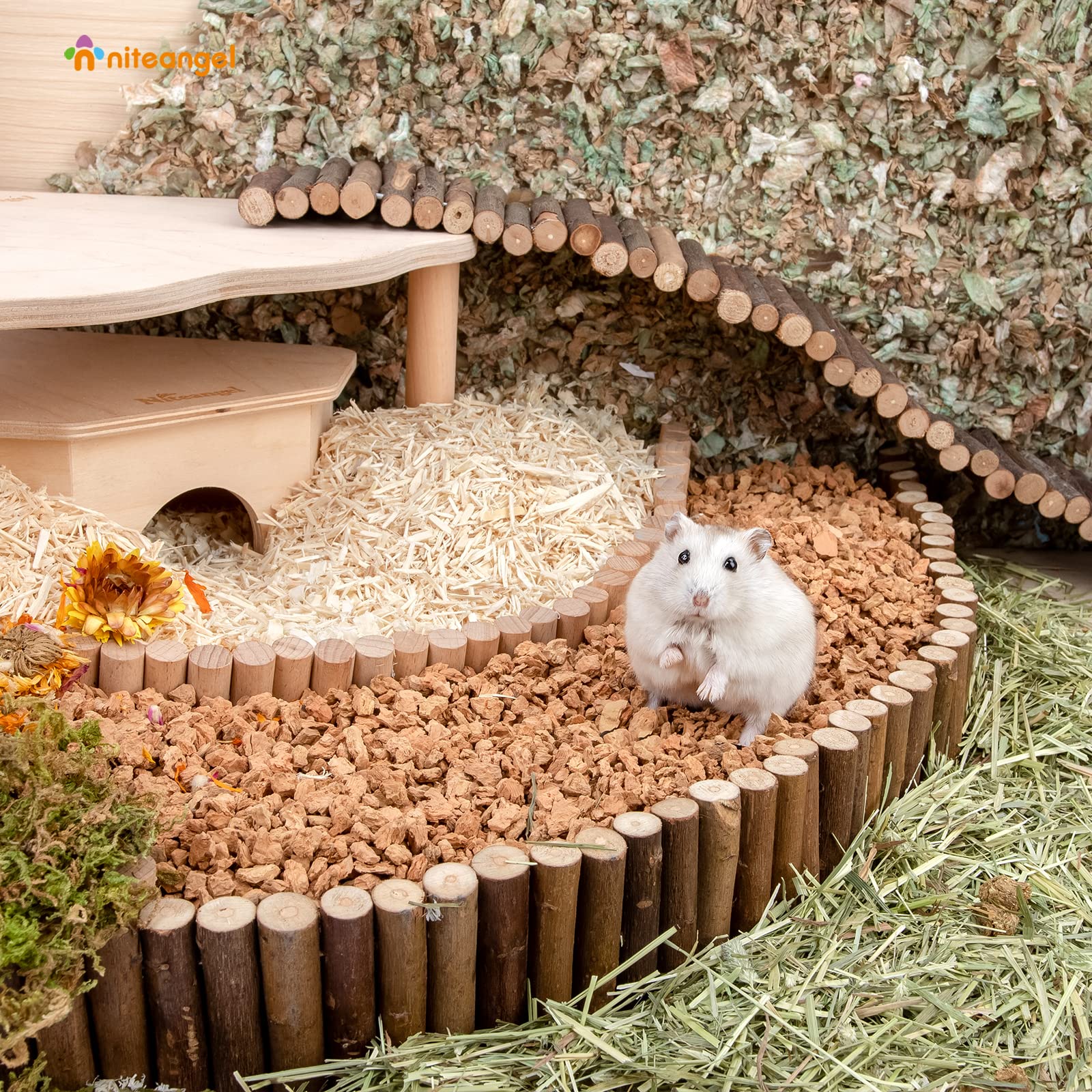 A hamster rolls in Niteangel cork hamster bedding.