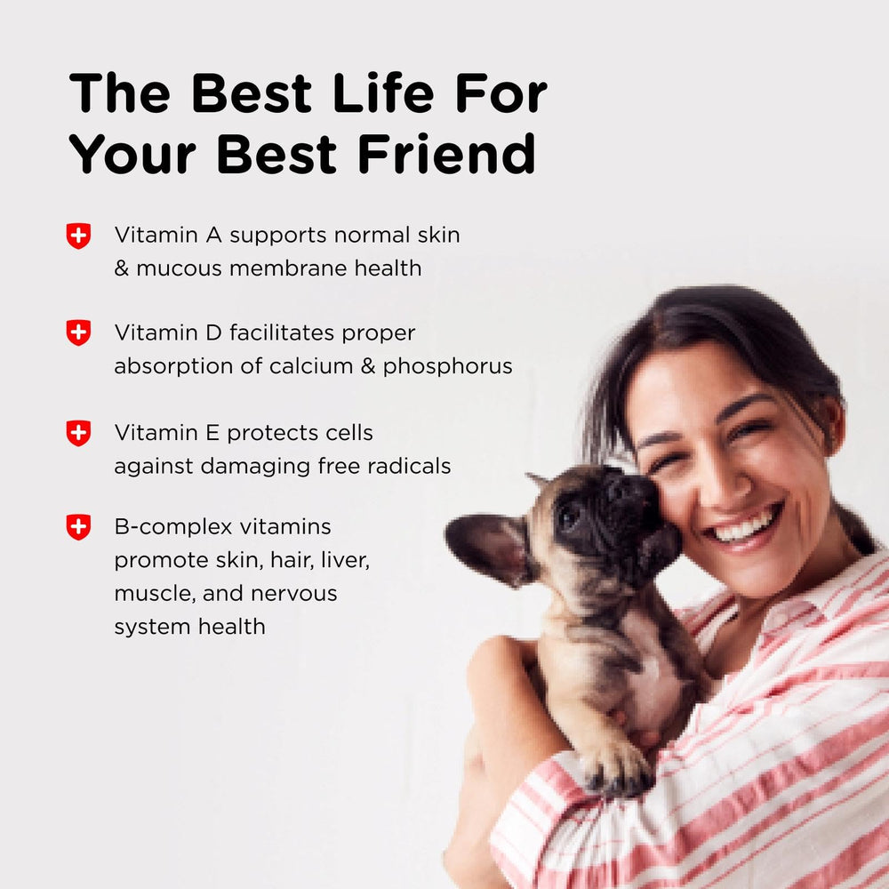 A puppy taking a Nutri-Vet Puppy multivitamin chewable.