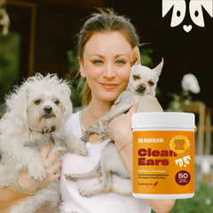 OH NORMAN! dog ear cleaning finger wipe being used to clean a dog's outer ear.
