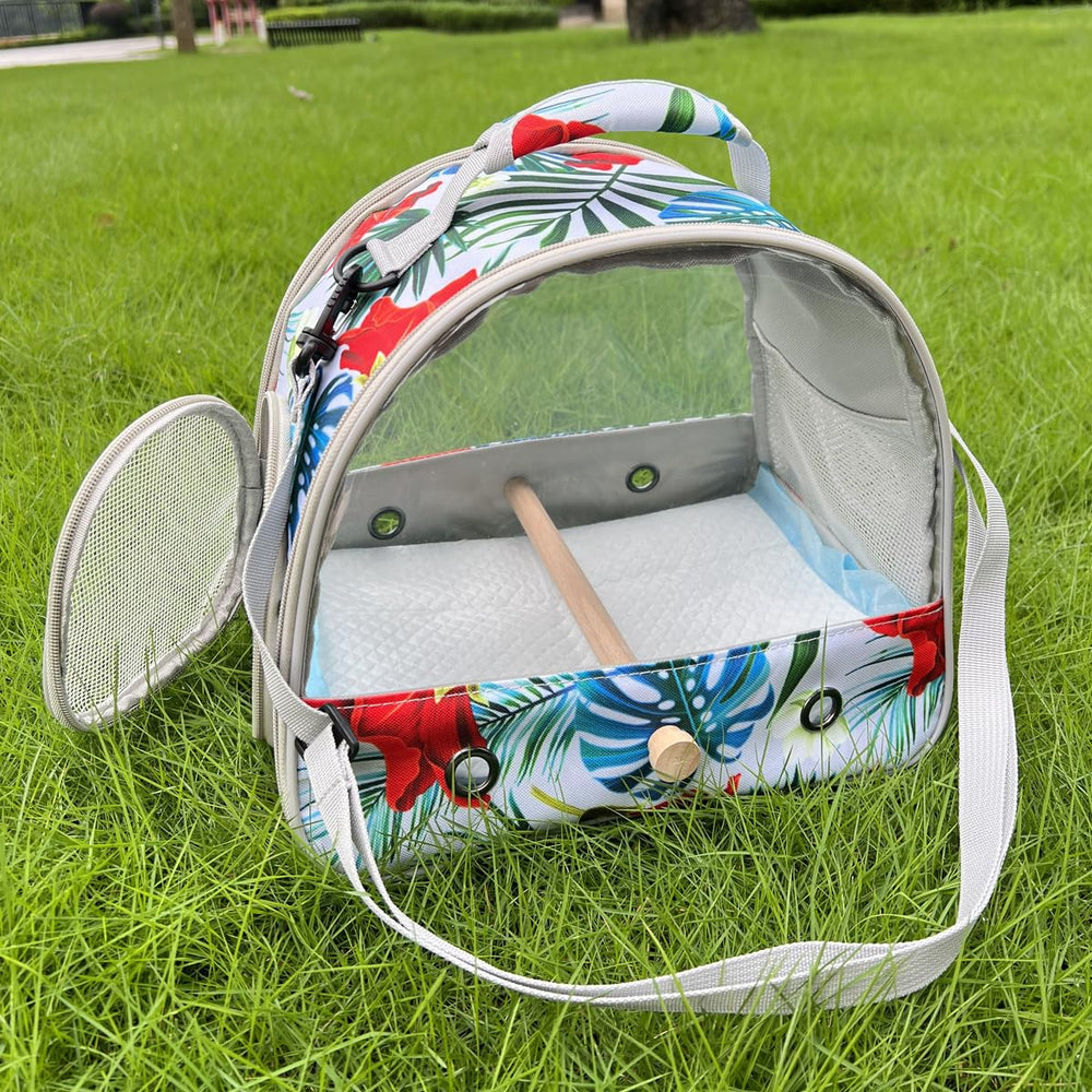 ORIZZP bird travel carrier interior with the wooden perch and absorbent pads.