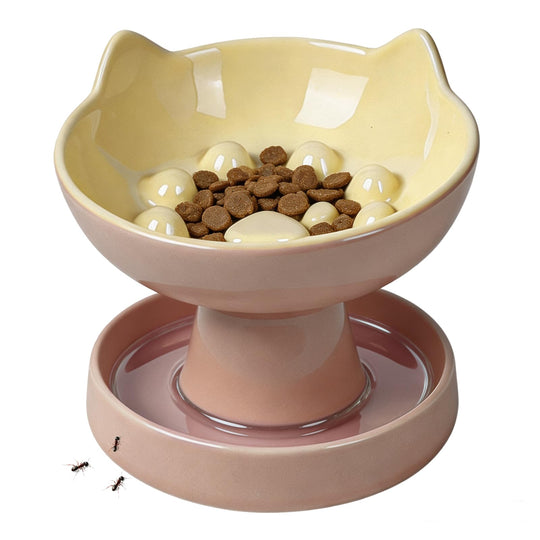 Pawinner raised slow feeder cat bowl shown from the front in pink ceramic.