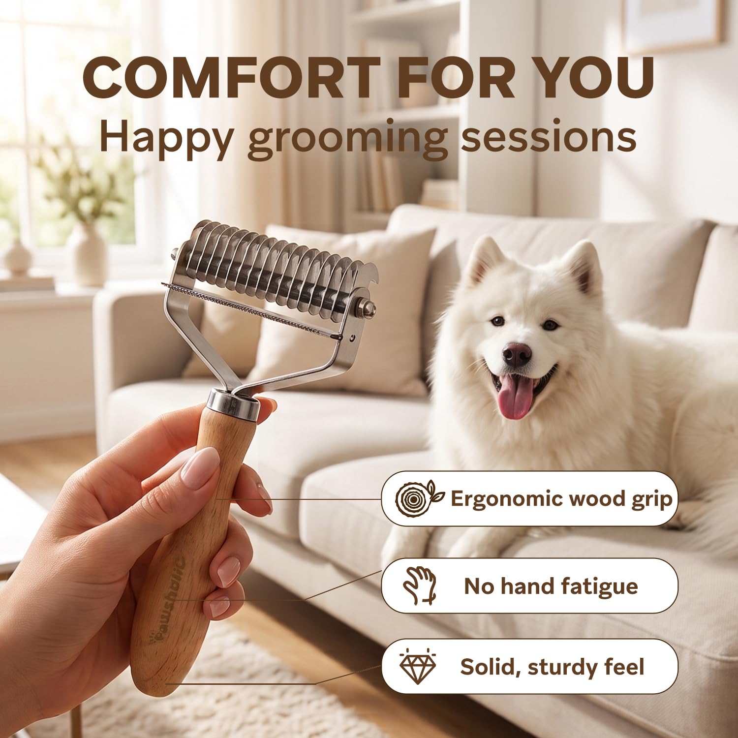 PAWSHOLIC undercoat rake being used to groom a cat.