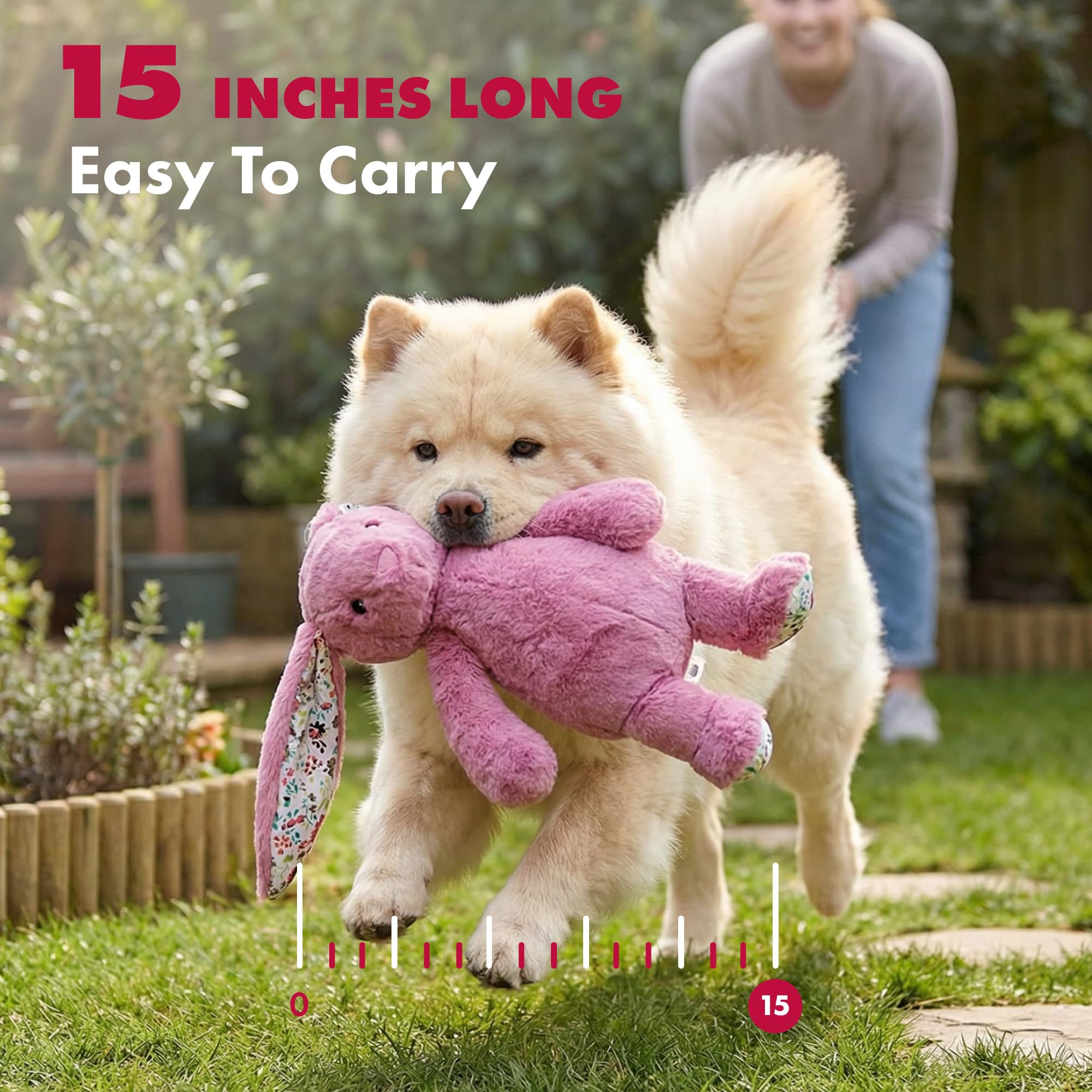 Pet Lou rabbit plush dog toy being carried by a dog during supervised play.