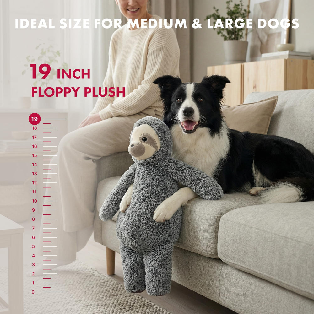Pet Lou stuffingless floppy sloth dog toy being carried by a dog during supervised play.