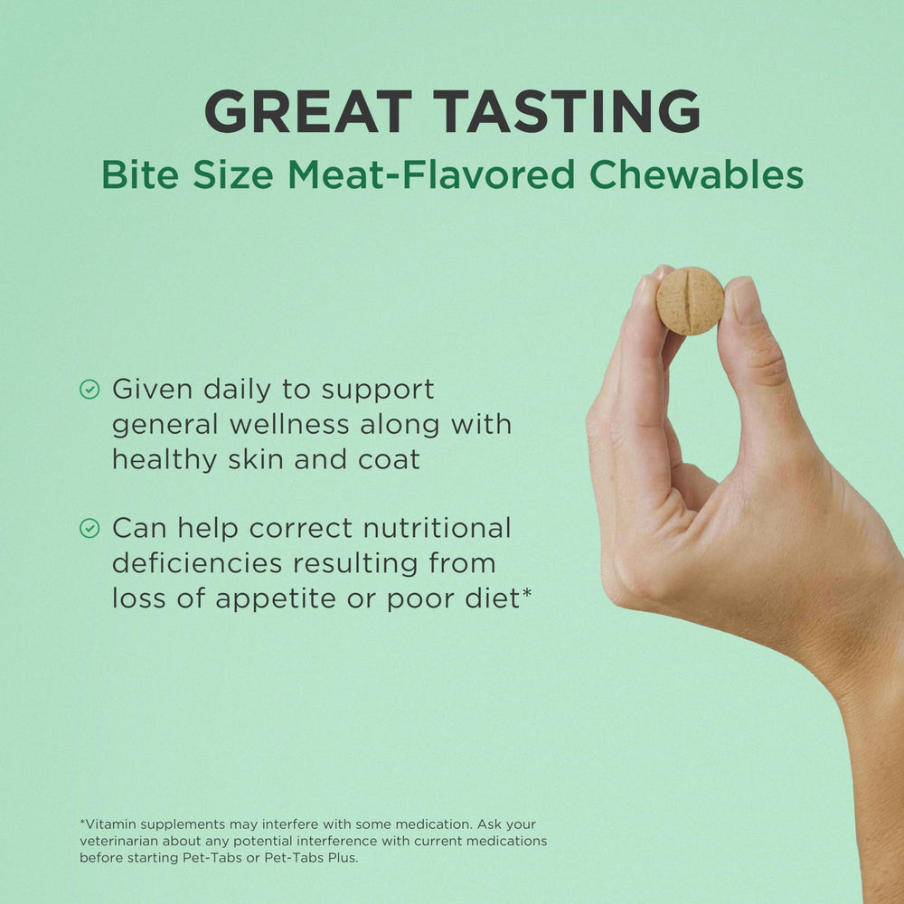 Pet-Tabs dog multivitamin being offered to a dog as a treat before feeding.