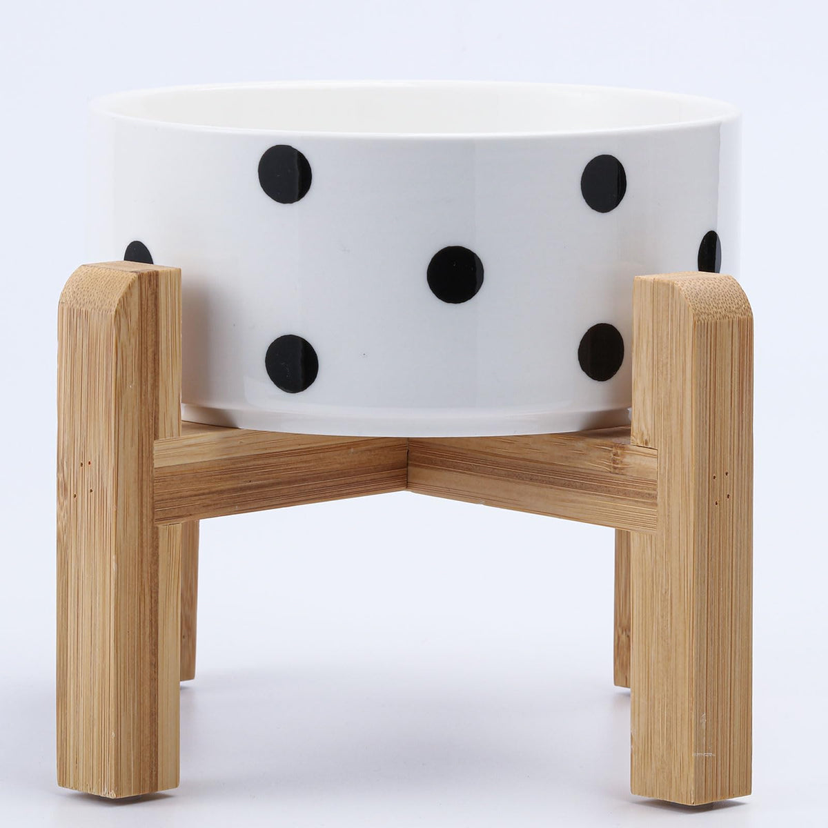 Petygooing ceramic pet bowl shown from the front with its bamboo stand.