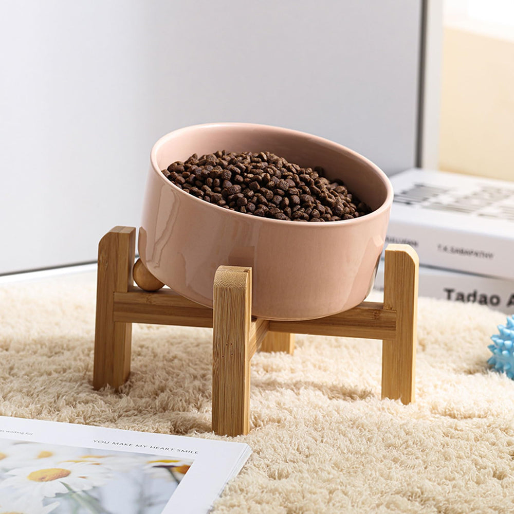 Petygooing ceramic pet bowl shown in its khaki color with bamboo stand.
