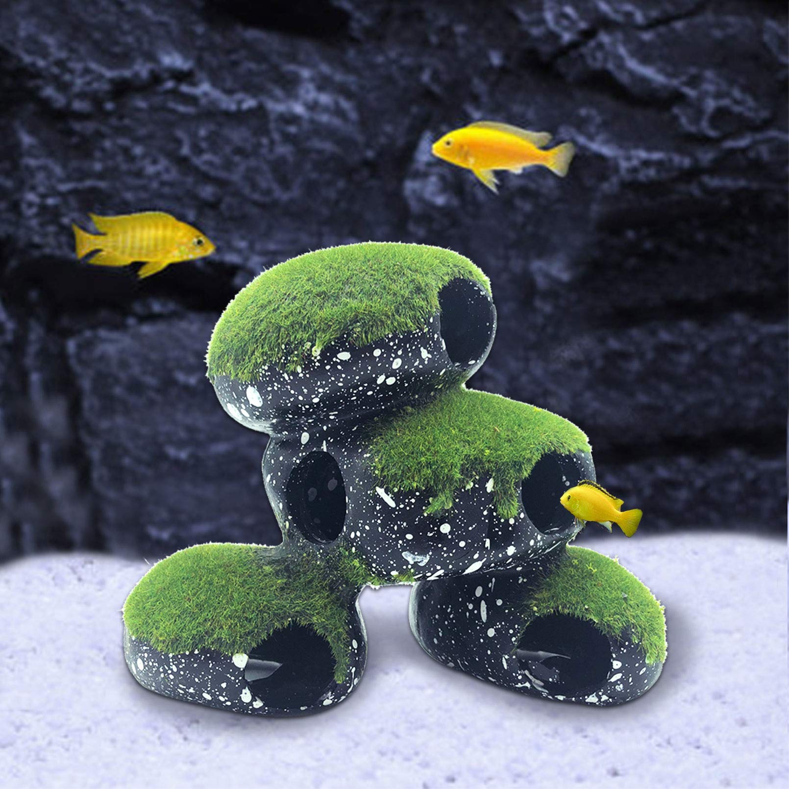 PINVNBY Stone Aquarium Hideaway being wiped and rinsed with warm water for cleaning.